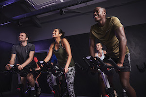 2019_31_male_female_group_spin_class_happy